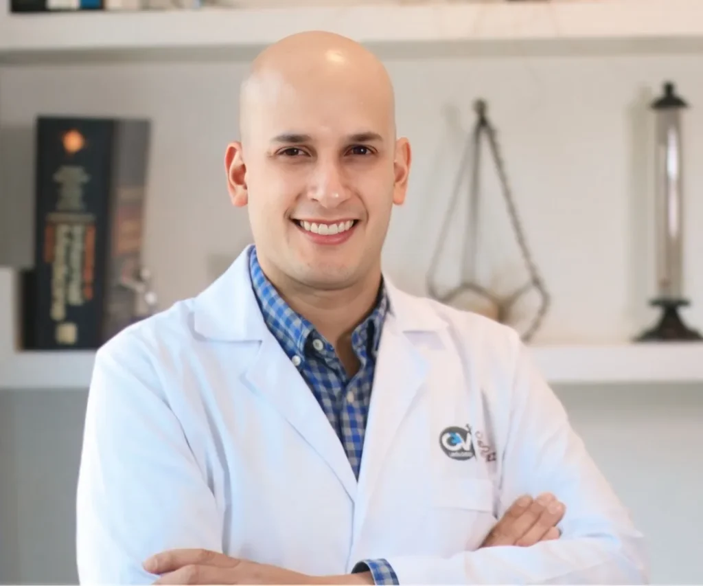 Dr. Carlos Velásquez, urologist in Medellín, in his medical office